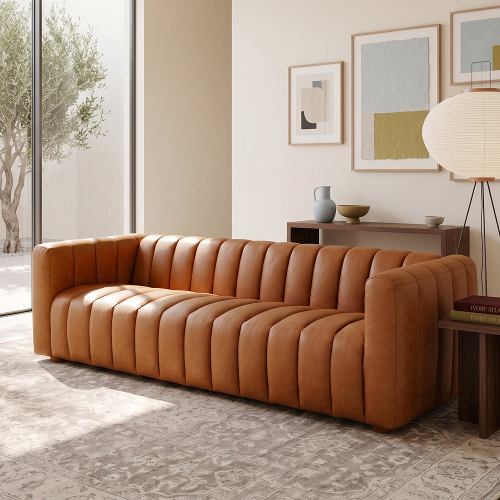 Clara modern tan leather sofa with vertical channel tufting and small wooden feet | MidinMod