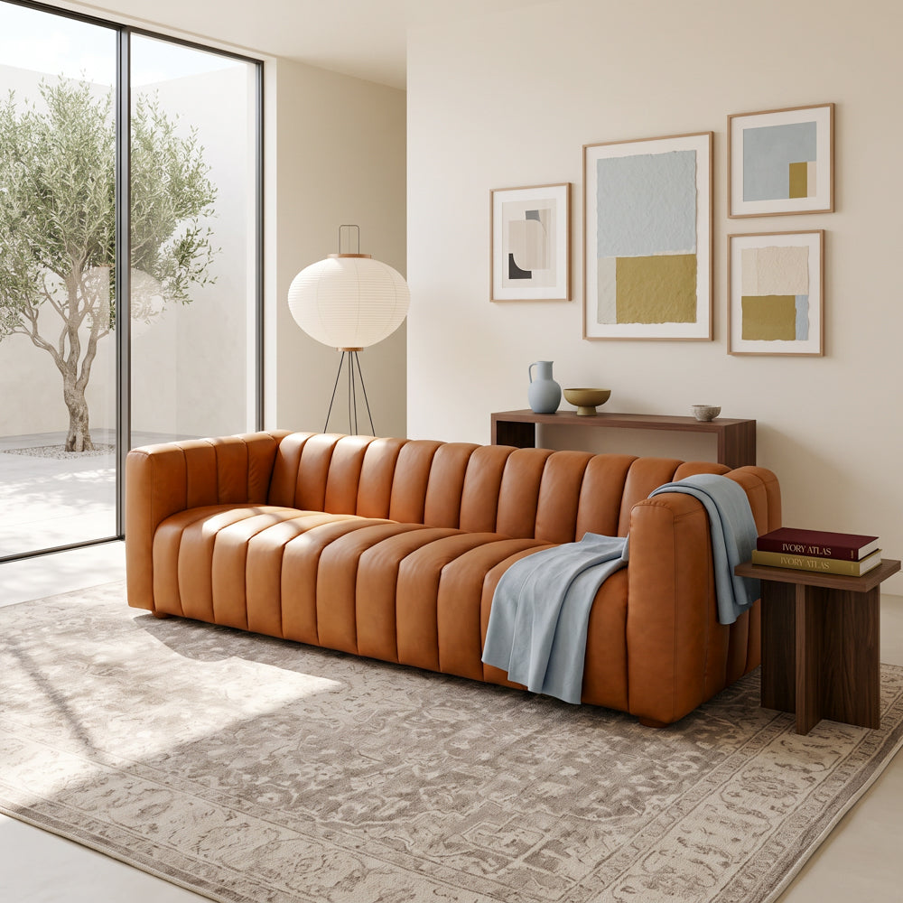 Clara modern tan leather sofa with vertical channel tufting and small wooden feet | MidinMod