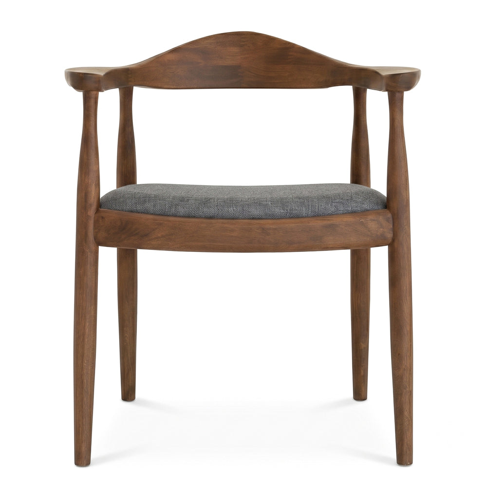 Front-on studio shot of Freya dining chair showing the arched walnut backrest and grey fabric seat.