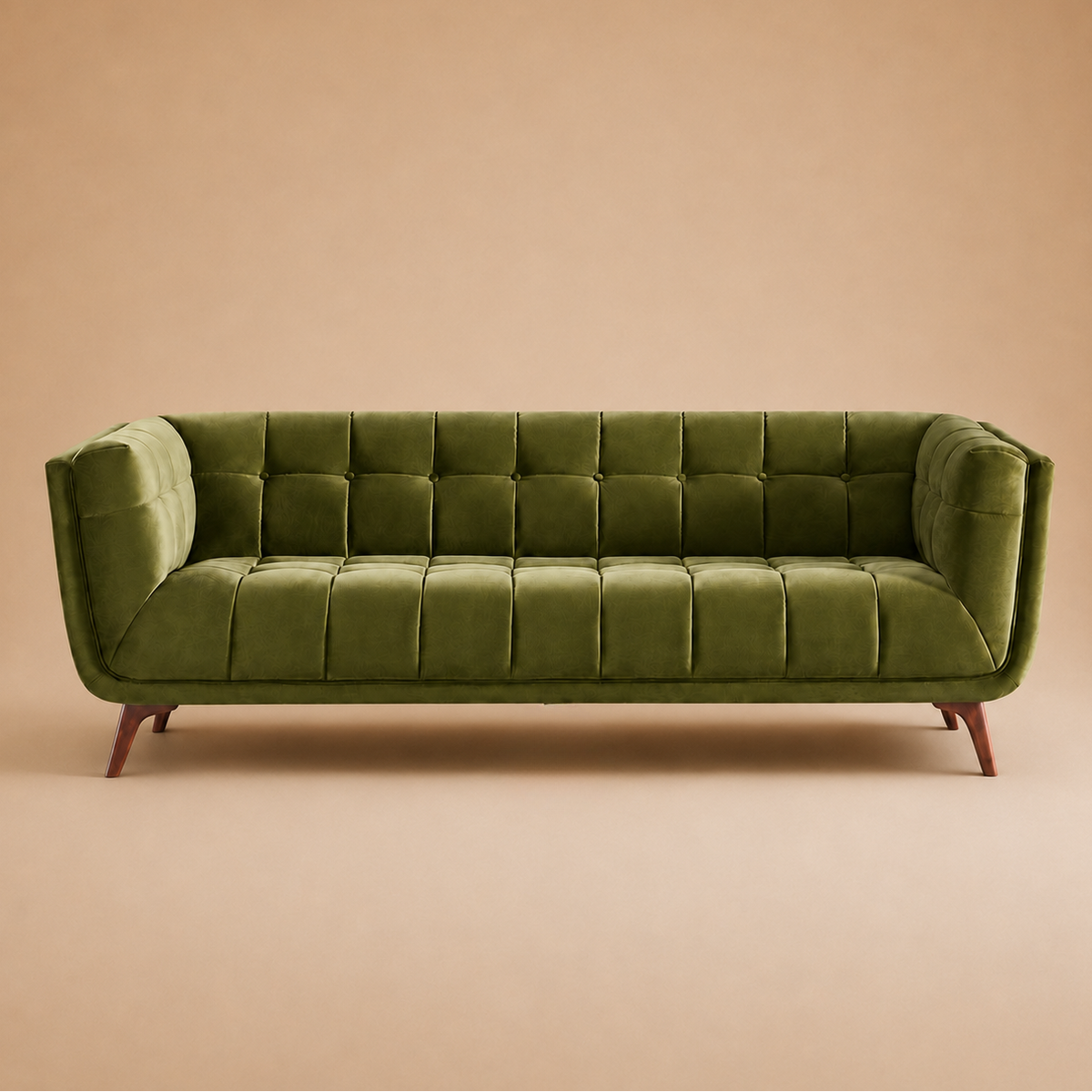 Kano olive green velvet sofa shown straight on against a warm beige backdrop, tufted back and tapered wood legs