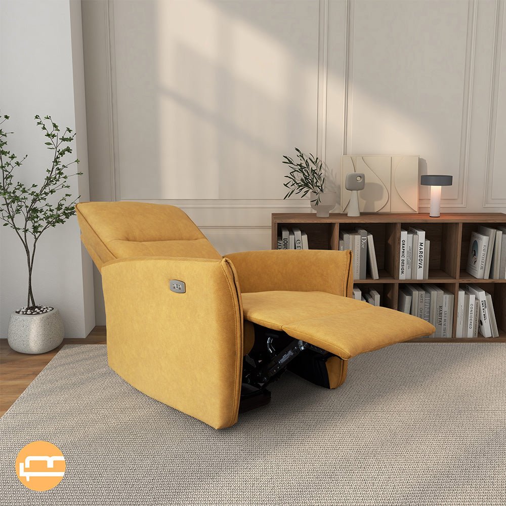 Yellow recliner fully reclined with backrest tilted and legrest out, angled living room view