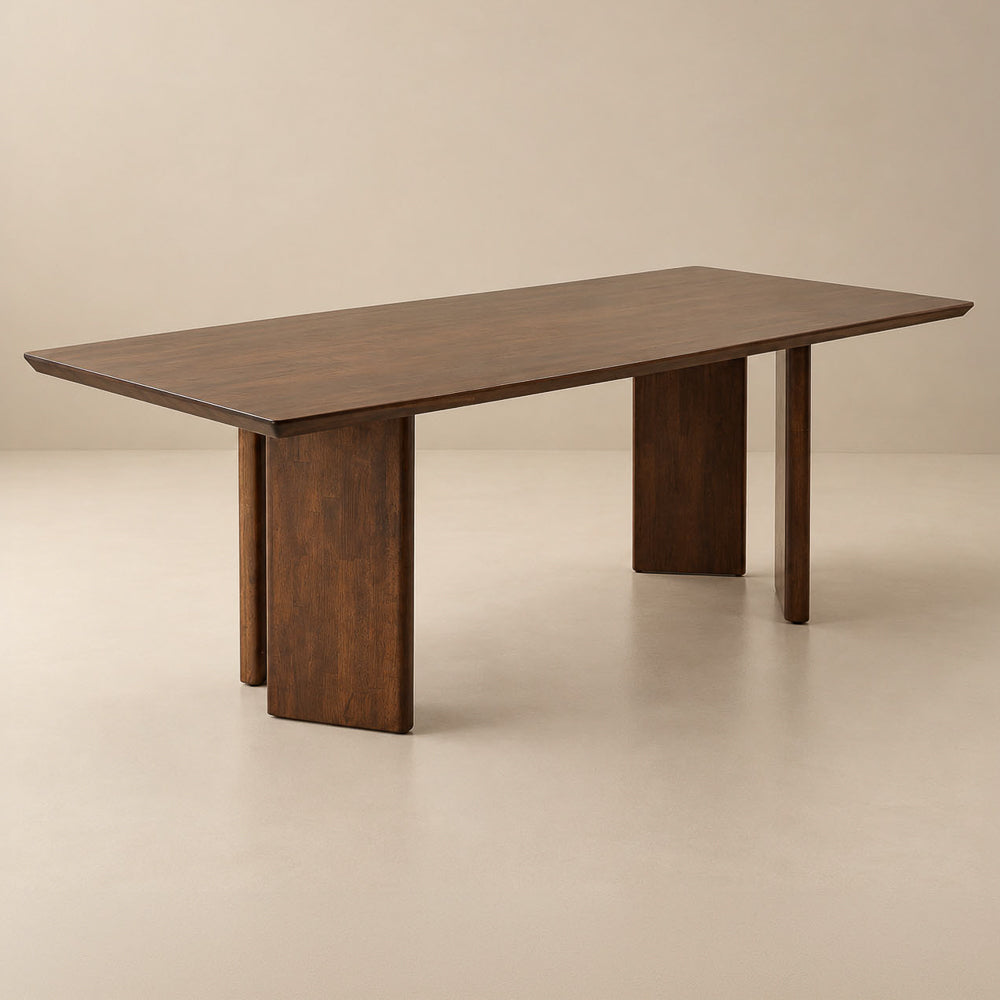 Walnut-toned rectangular dining table with flat panel legs, silo studio.