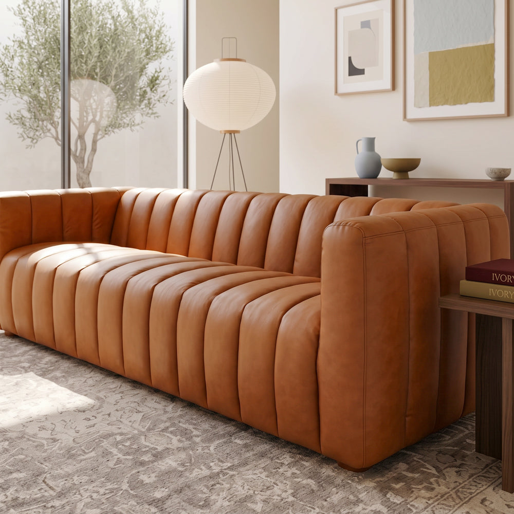 Clara modern tan leather sofa with vertical channel tufting and small wooden feet | MidinMod