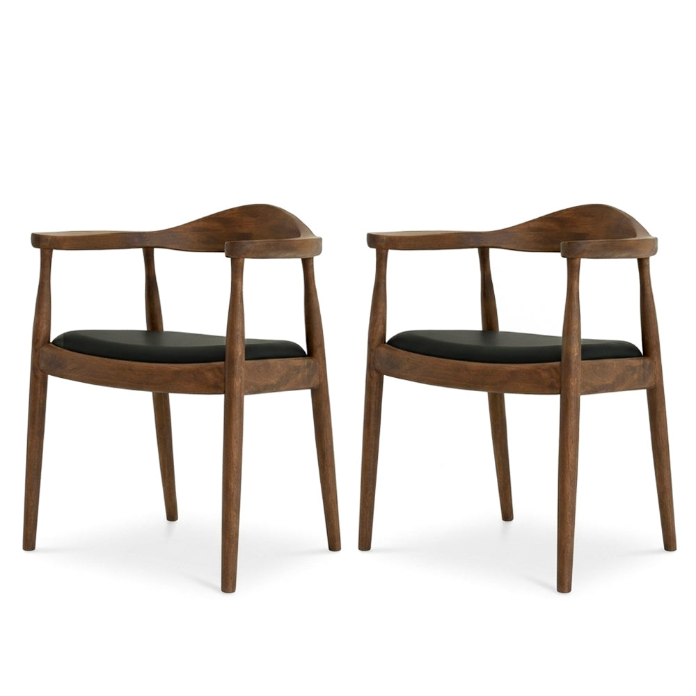 Pair of Freya dining chairs side by side on a white background, both facing slightly toward the camera