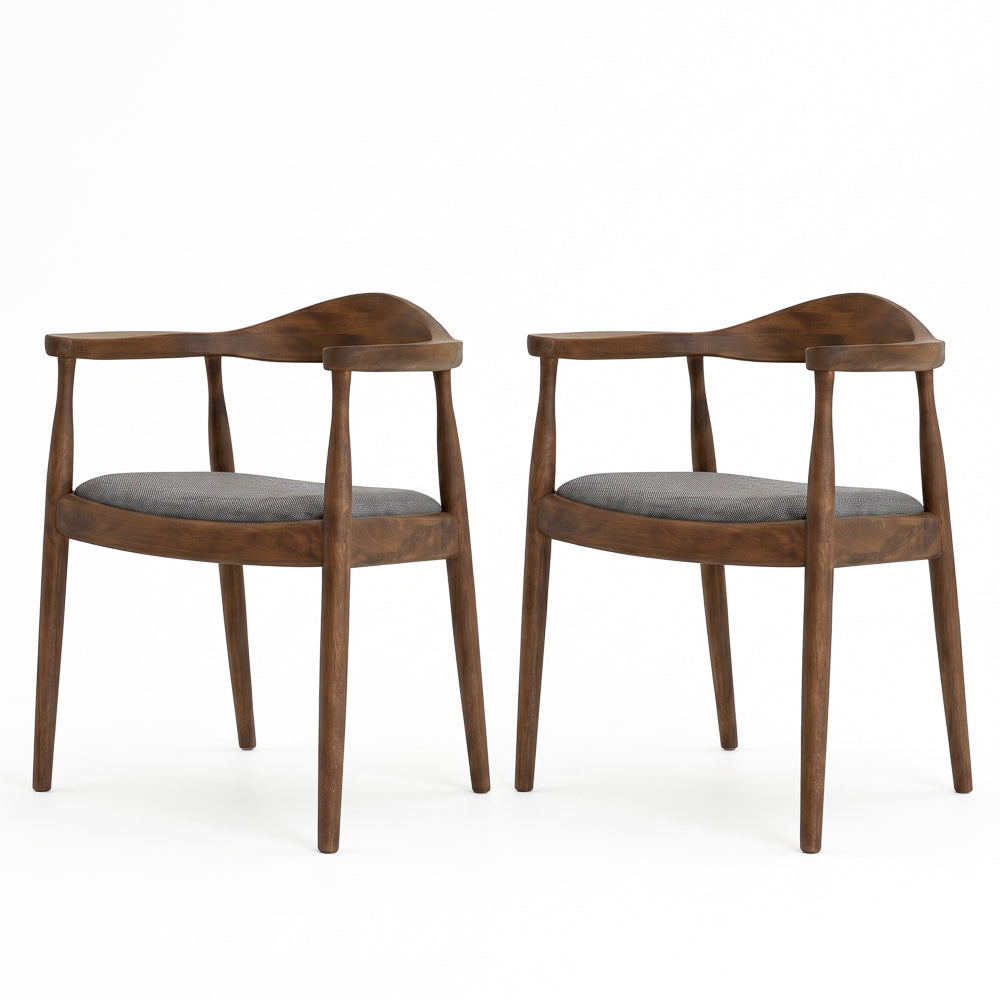 Pair of Freya dining chairs side by side on a white background, grey seats and walnut frames.