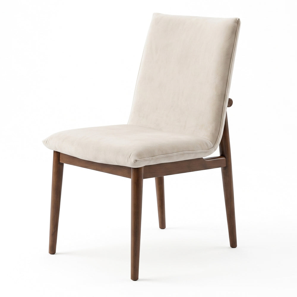 Single beige velvet dining chair at a three-quarter angle, isolated on white