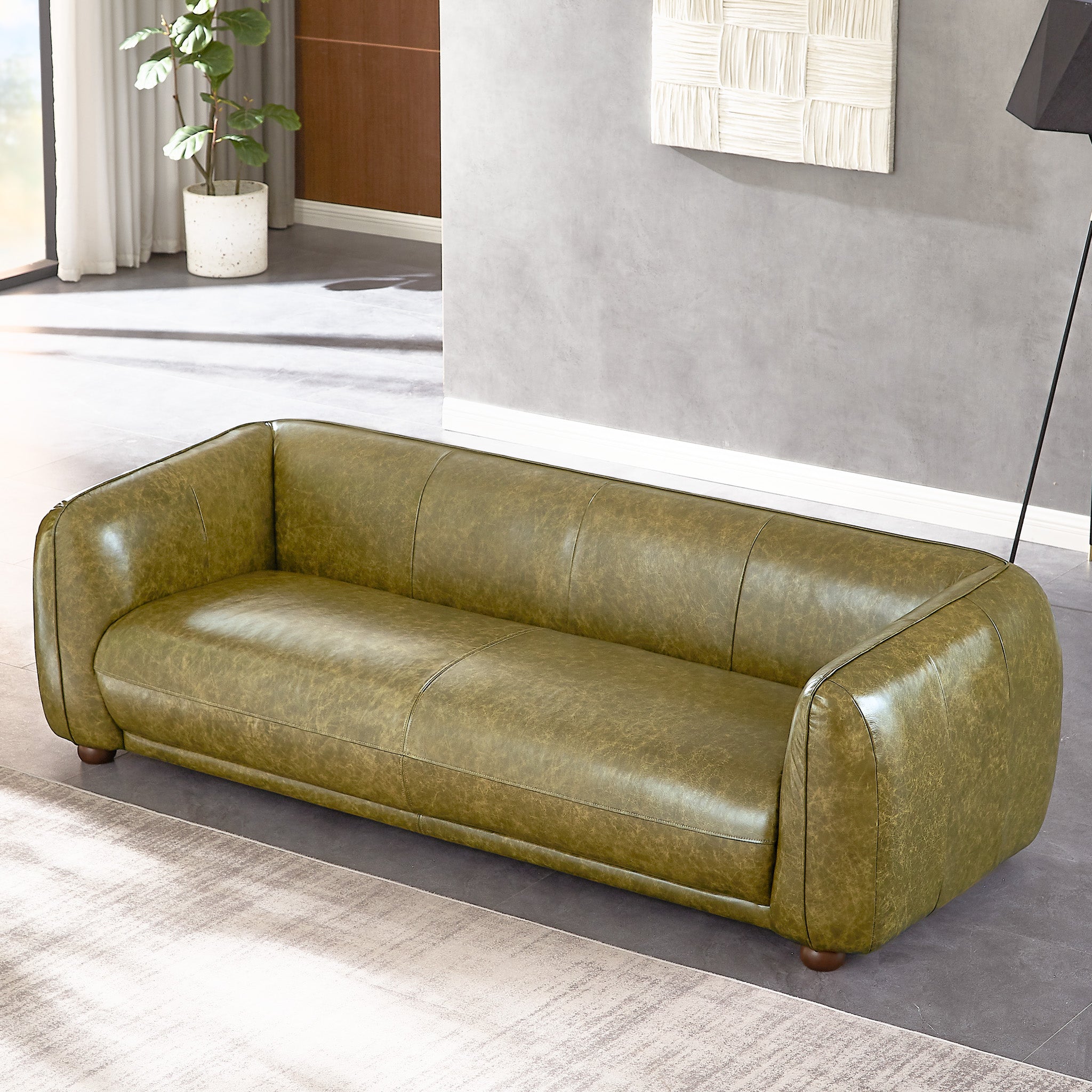 Green leather deals sofa