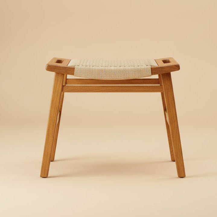Kermit Stool Tan Loom bar stool, straight-on front view of woven seat and wood frame on beige backdrop